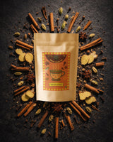 Brew Your Sip Special Masala Chai pack of 2 surrounded by cinnamon sticks, cardamom and star anise spices
