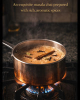 Aromatic masala chai brewing in copper pot with whole spices – cinnamon, cloves and cardamom – Brew Your Sip