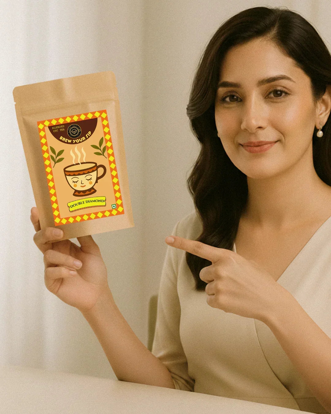 Model holding Brew Your Sip's Double Diamond CTC Chai pack