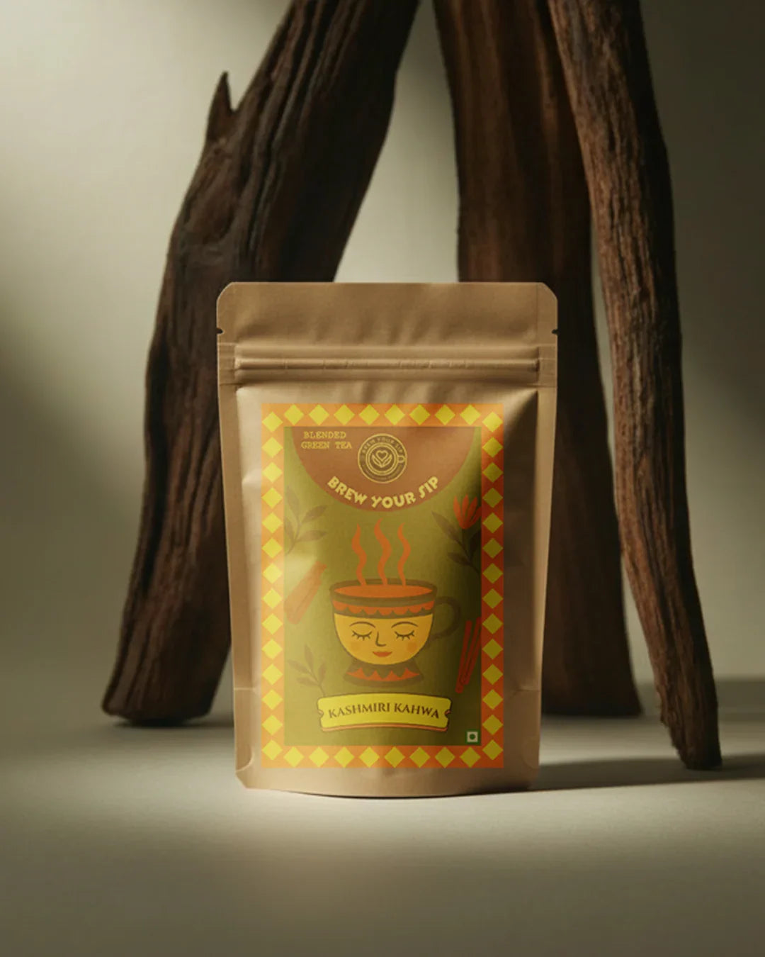 Kashmiri Kahwa tea packaging with a decorative label on a neutral background