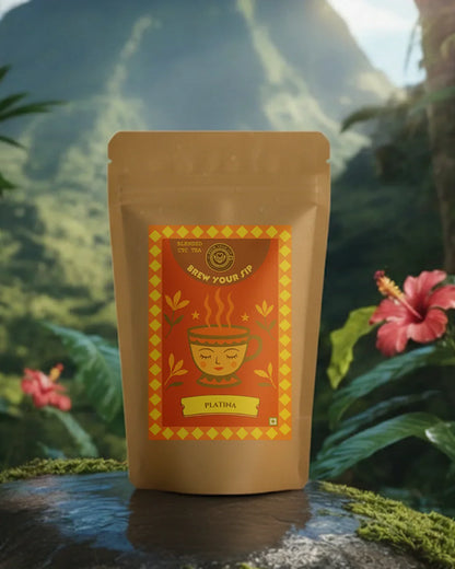 Brown package with red label featuring a tea cup design, placed on a natural background with plants and flowers.