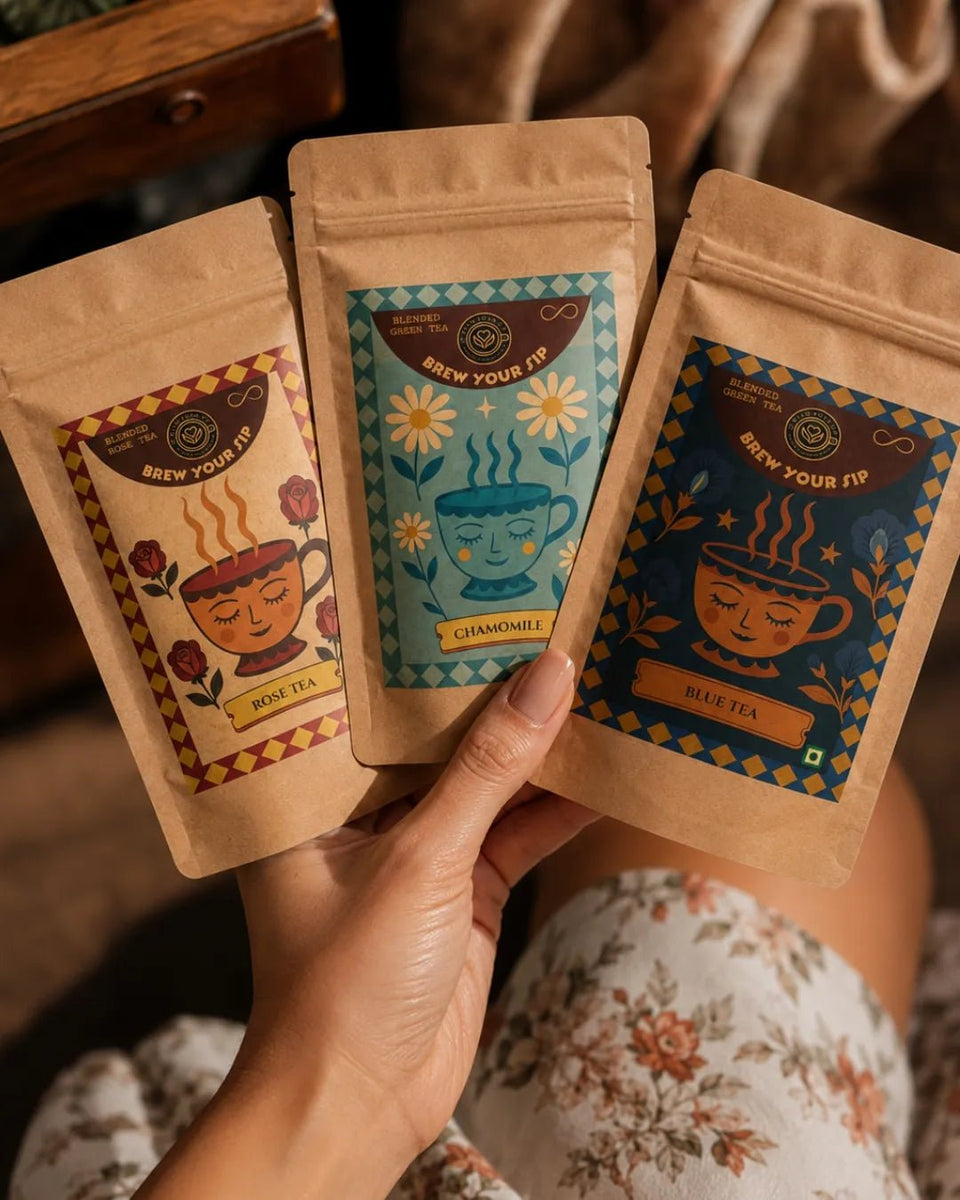 Hands holding three Brew Your Sip wellness sampler pouches