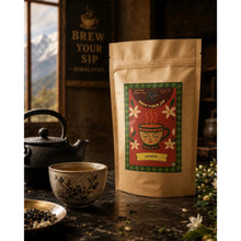 Darjeeling sampler pouch beside a cast-iron teapot and cup in a wood-panelled room, view 2