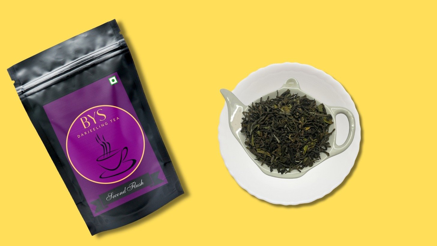 Brewyoursip's Second Flush Darjeeling Tea pack is kept beside the tea leaves